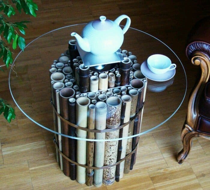 7. Merge different sized bamboo sticks to create the base of a glass coffee table